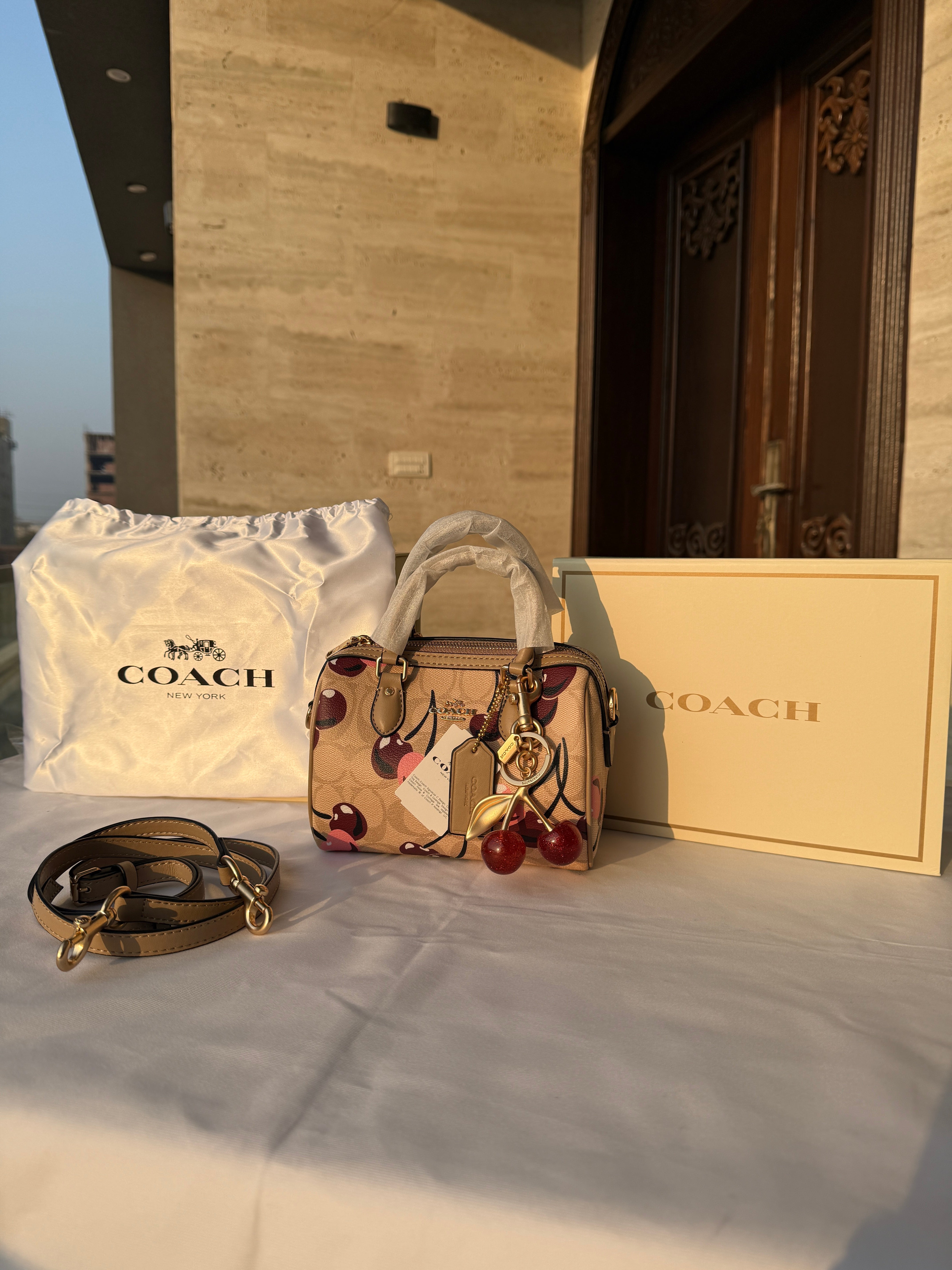 COACH CHERRY PATTERN BAG IN BROWN WITH CHERRY CHARM