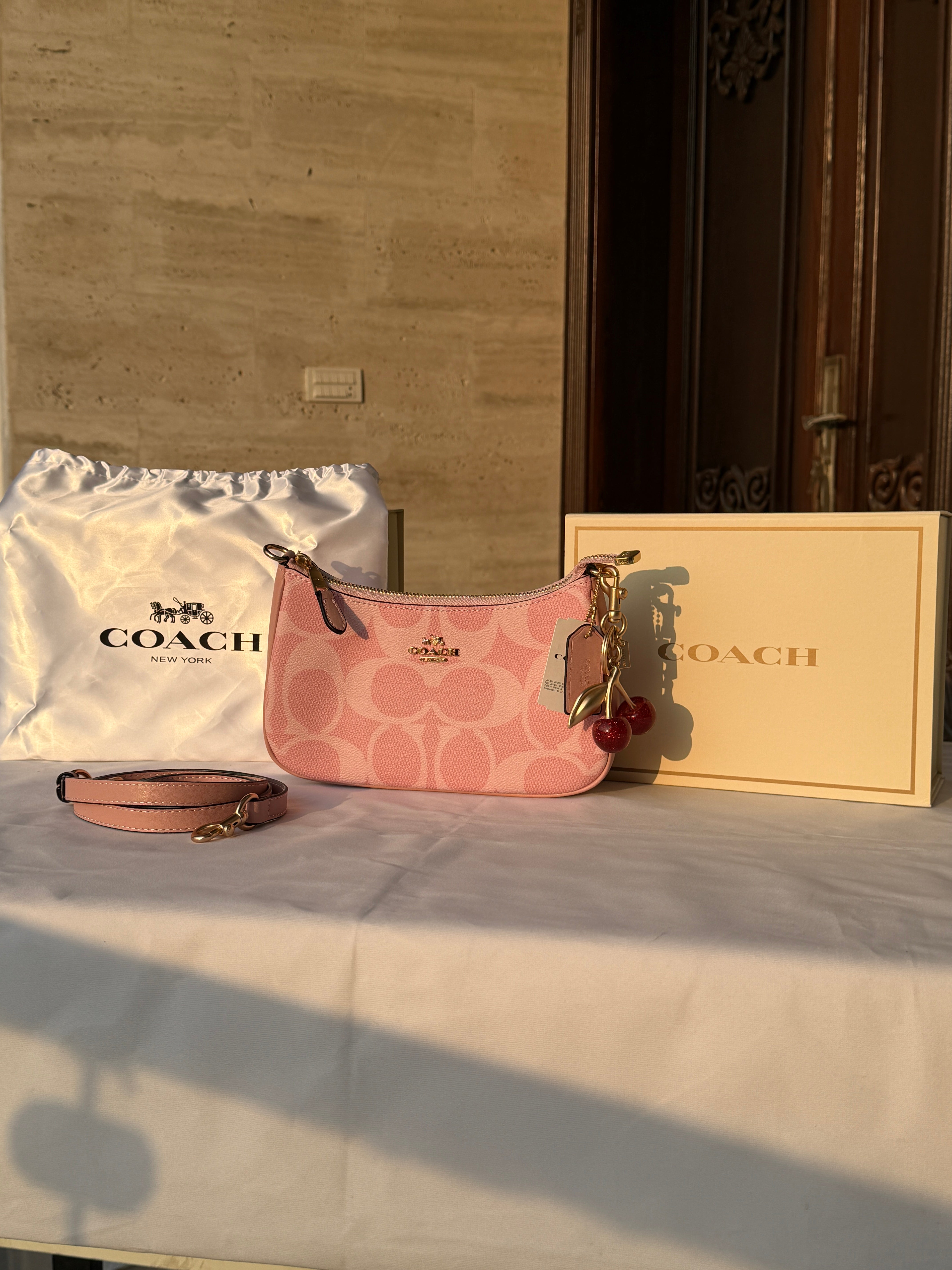 COACH PINK BAG WITH CHERRY CHARM AND 2 STRIPS