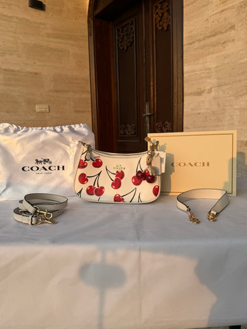 COACH WHITE CHERRY PATTERN BAG WITH CHERRY CHARM AND 2 STRIPS