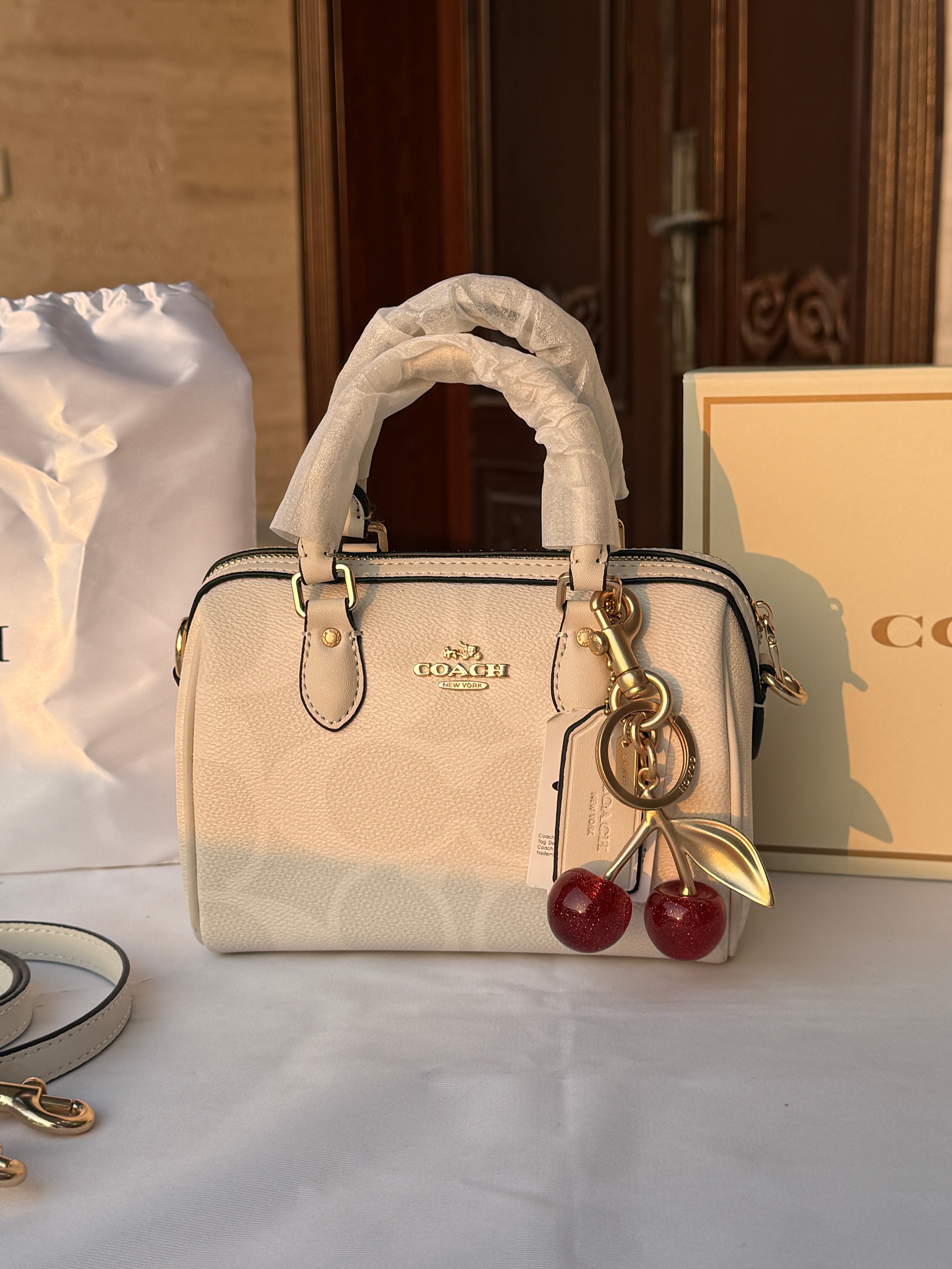 COACH WHITE PATTERN BAG WITH CHERRY CHARM
