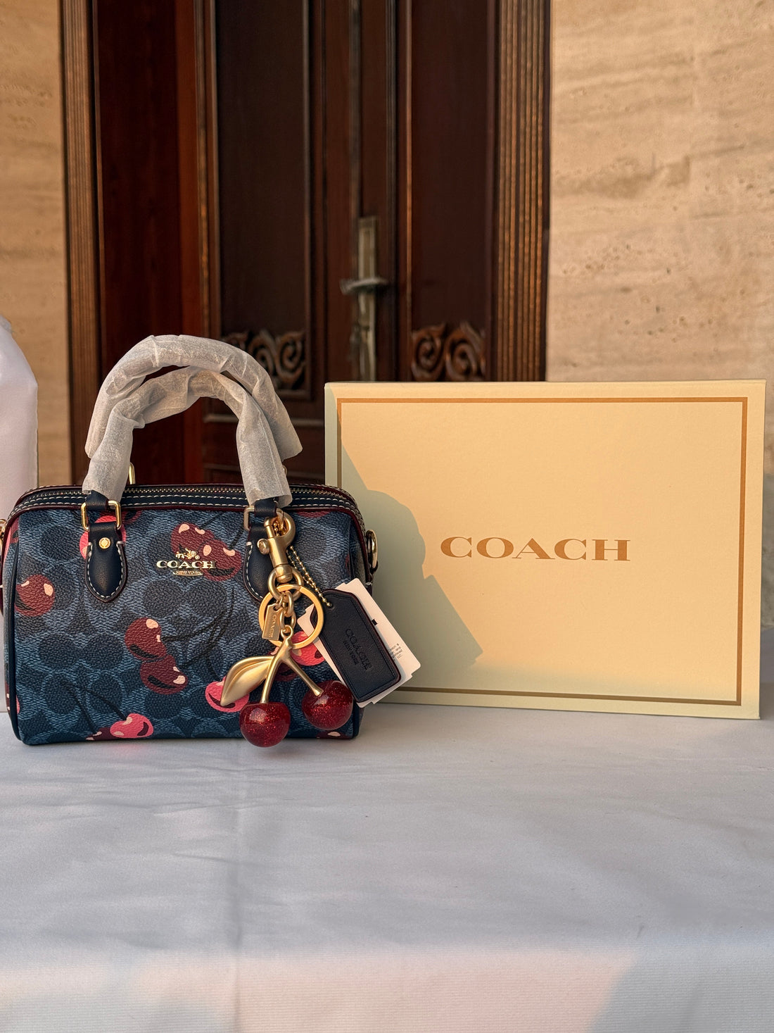 COACH BLUE BAG WITH CHERRY PATTERN AND CHERRY CHARM