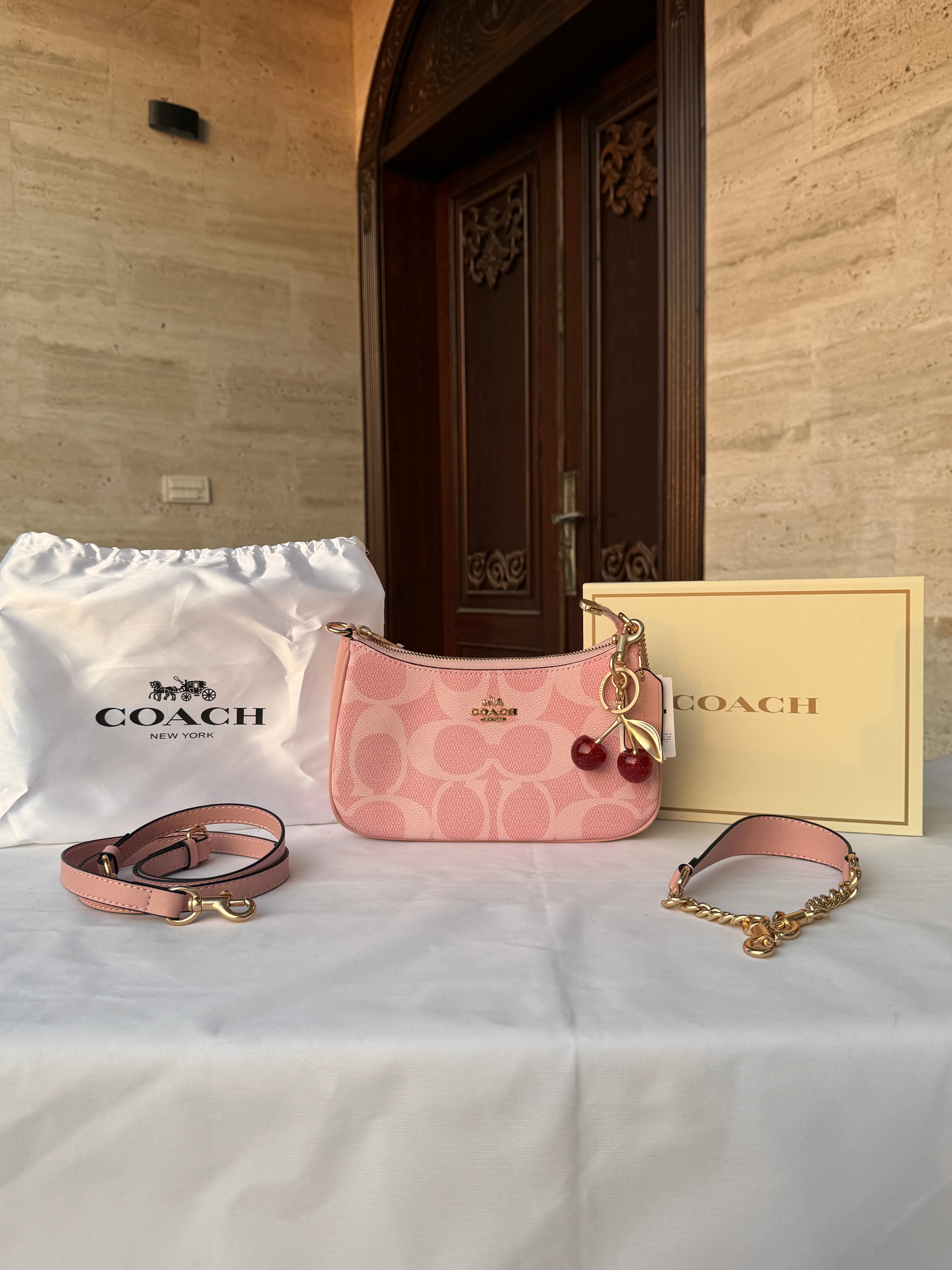 COACH PINK BAG WITH CHERRY CHARM AND 2 STRIPS
